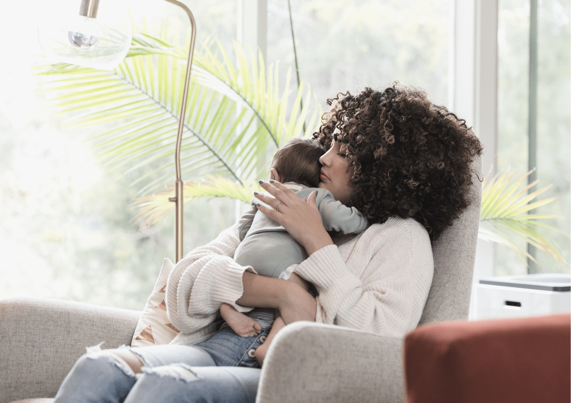 header image of a lonely mother holding a baby